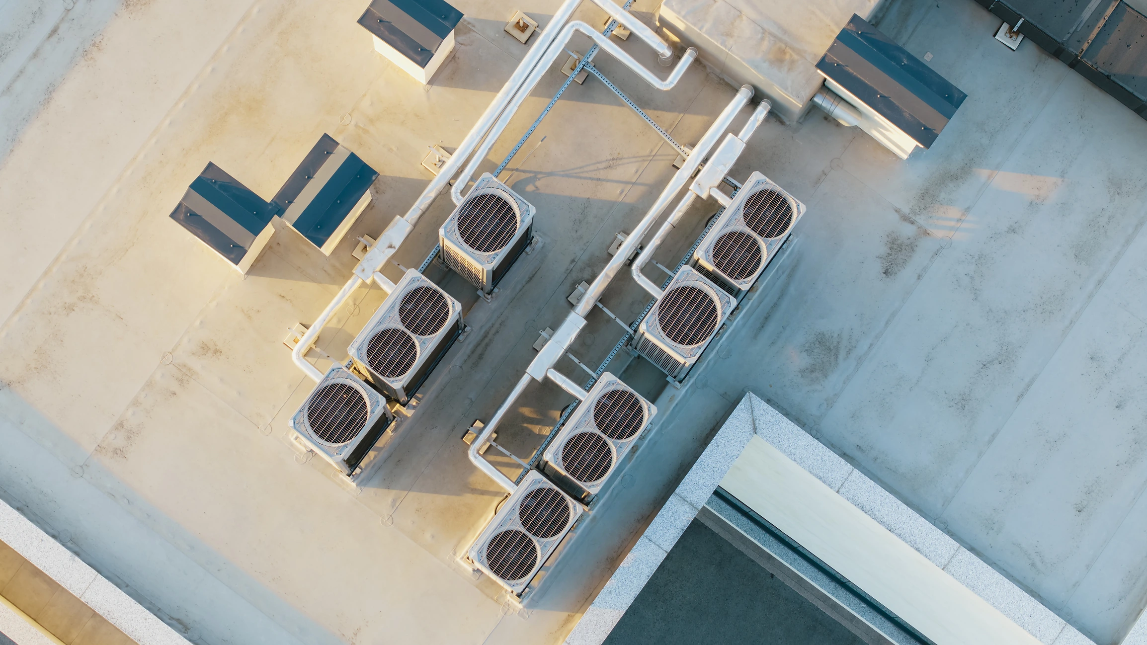 Rooftop HVAC condenser units and refrigerant piping