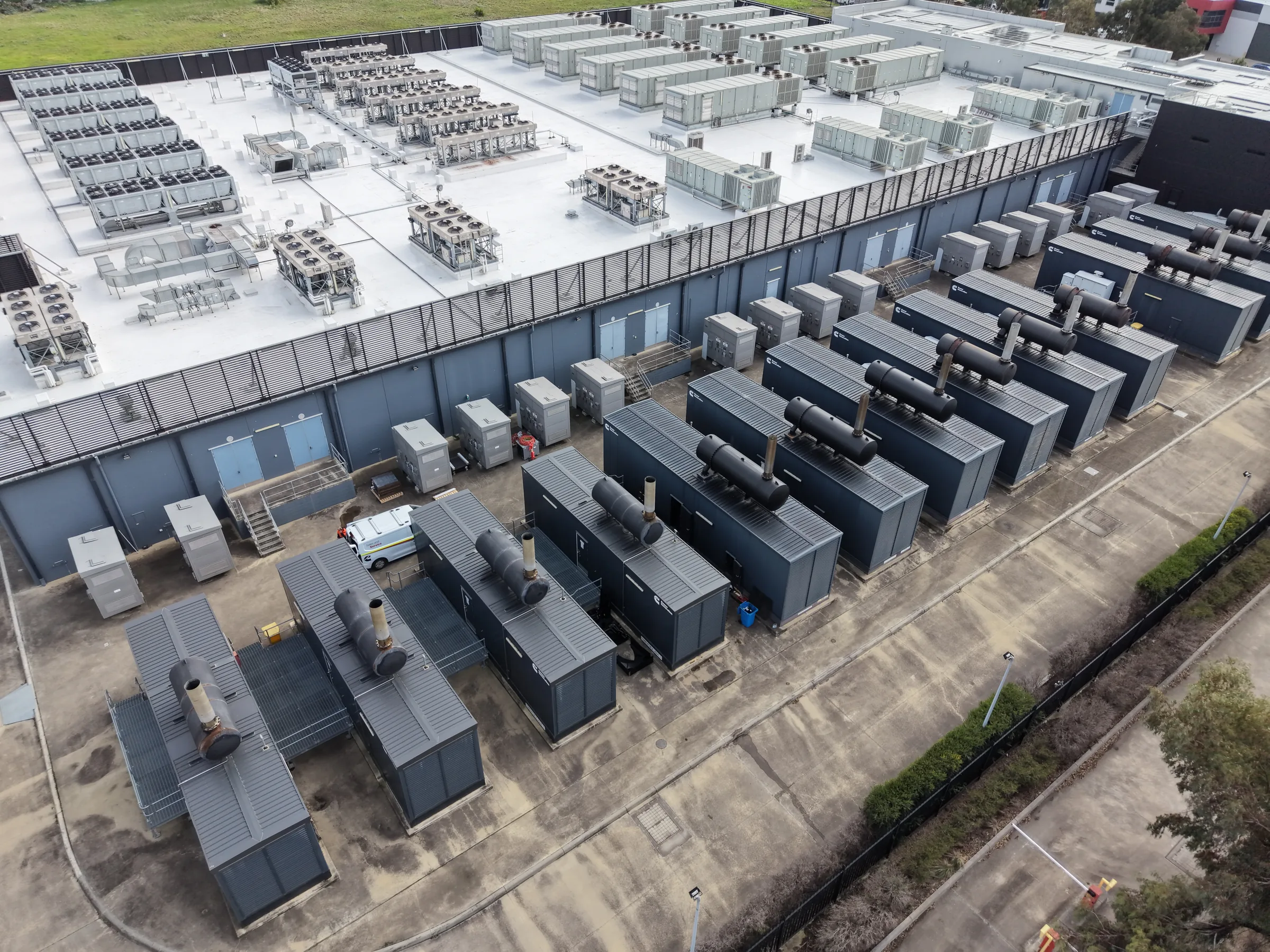 Backup generators and rooftop cooling equipment at an industrial facility