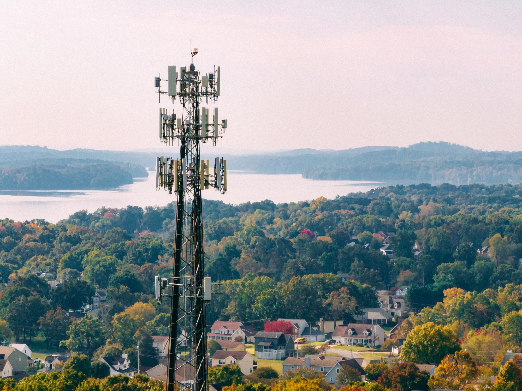 Telecommunications tower overlooking a suburban landscape